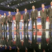 Ten Republicans running for president in 2016 stand on stage before a debate.