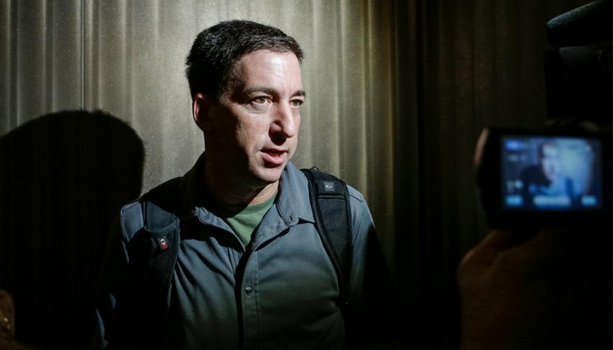 Reporter Glenn Greenwald speaks with the press in Hong Kong.